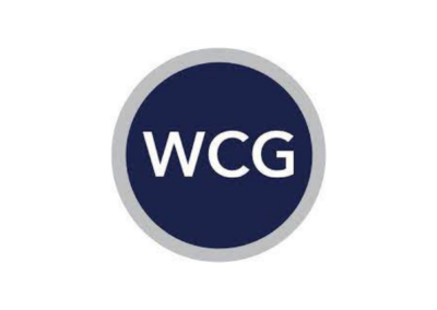 A navy circle with a gray outline. Inside the navy circle it reads "WCG" in white capital letters.